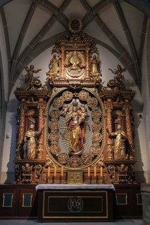 Magnificent rosary altar in Radolfzell Minster with figures of saints and golden decoration,