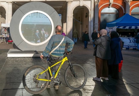 People on the Cornhill in the town centre view the first ever UK Portal in Ipswich, Suffolk,