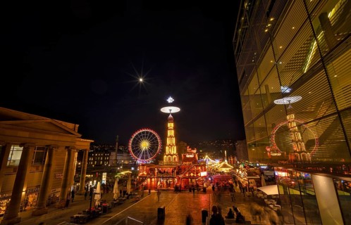 Night view, Christmas market with Christmas pyramid, reflection in the art museum, cube, Ferris