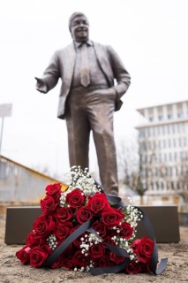Red roses with a mourning ribbon lie in front of the Walter LÃ¼bcke memorial during the