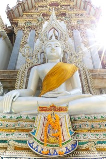 Buddha statue with tunic, Bhumispara mudra, Buddha Gautama at the moment of enlightenment, at the