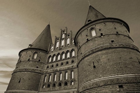 Holstentor, historic city gate from 1478, evening sky, cuttlefish, Holstentorplatz, Hanseatic City