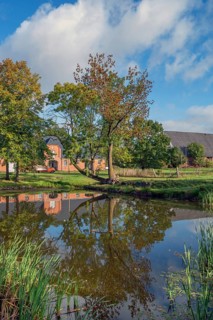 Historic stables with pond at Gut Othenstorf, 1923, Othenstorf, Mecklenburg-Western Pomerania,