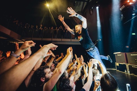 Billy Lunn, singer and guitarist from The Subways, crowd-surfing the fans live on For Eternity Tour
