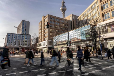 Passers-by on a GrunerstraÃŸe pedestrian crossing near Alexander Platz, Berlin Radio Tower, Berlin,