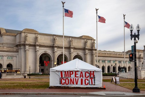 Washington, DC - A large sign outside Union Station calls for impeachment and conviction