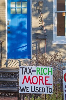 Washington, DC - Signs outside a home on Capitol Hill opposing Trump Administration policies