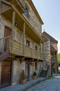 Ancient building with wooden ornaments and outdoor stone steps, Old Town, Sharambeyan Street,