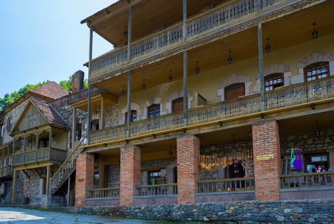 Large historic building with brick and wooden verandas, rustic charm, Old Town, Sharambeyan Street,