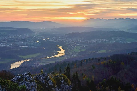 View of the Jura foothills from the Gisliflue, in the light of the setting sun, in the foreground