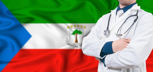 Equatorial Guinea healthcare concept. Male doctor on Equatorial Guinea flag. Doctor with crossed