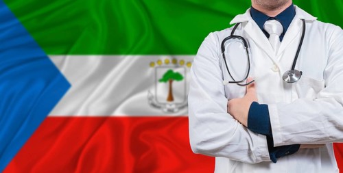 Male doctor with stethoscope on Equatorial Guinea flag. Doctor holding stethoscope on Equatorial