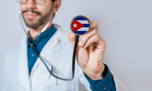Doctor holding stethoscope with Cuba flag. Cuba health and care concept. Cuba flag on stethoscope