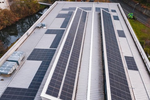 Roof with solar panels on an industrial building in an urban environment, PV at Walther Lindner