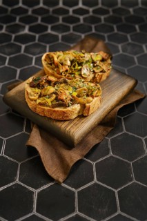 A tasty mushroom sandwiches feature fried honey mushrooms, enoki mushrooms, champignon, and leek.
