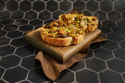 Freshly made mushroom sandwich features honey mushroom, enoki mushroom, champignon, and leek on