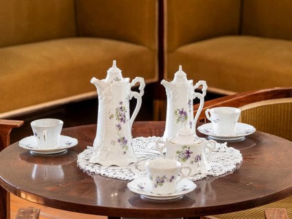 Vintage coffee service on the table, old porcelain