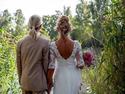 Elderly couple's wedding, look at the lake and reeds and look at the water