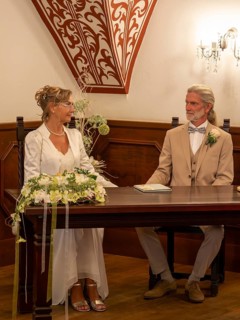 Elderly couple's wedding, registry office, attach rings