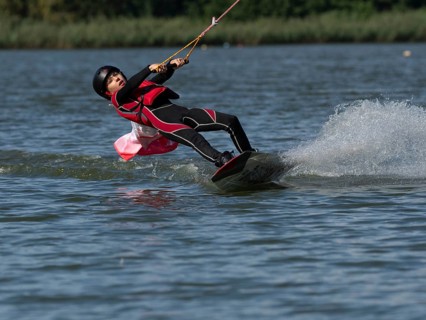 Boy or girl with wakeboard, sporty on the water, active water sports, wake park