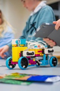 A colorful Lego robot is being assembled by children, Jugend Forschungszentrum Nagold, Calw