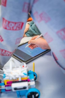 Person drawing with a stylus on a tablet, Jugend Forschungszentrum Nagold, Calw district, Germany