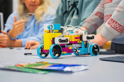 Children assemble a colorful robot on a table, Jugend Forschungszentrum Nagold, Calw district,