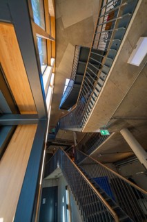 Innovative staircase with concrete walls and wood detailing, Amazonia exhibition, Gasometer,
