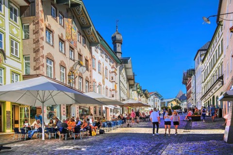 Historic market street with street cafe and typical gabled houses, Bad Tölz. Isartal, Upper