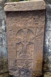 Detailed ancient relief with figures and ornaments carved in stone, Crossstone, Sevanavank