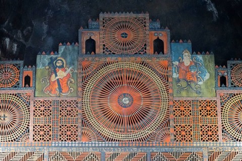 Ornamental altar decoration with complex geometric patterns and symbolic representations,