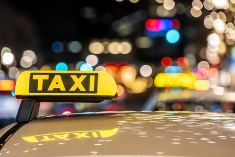 Taxi stop, on TauentzienstraÃŸe in Berlin, in the evening, Germany