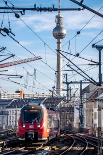 Railway line in Berlin, east of FriedrichstraÃŸe station, looking east, Berlin TV Tower, train on