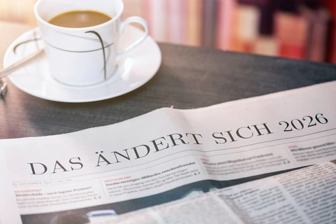 Close-up of a newspaper with the text THAT CHANGES 2026 (digitally edited)
