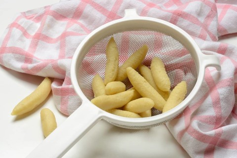 Raw Schupfnudeln in sieve, type of pasta, Germany