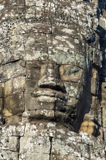 Huge stone-carved face of Bodhisattva Lokeshvara, also Avalokiteshvara, Bayon Temple, Angkor Thom,