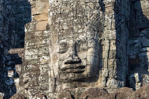 Huge stone-carved face of Bodhisattva Lokeshvara, also Avalokiteshvara, Bayon Temple, Angkor Thom,