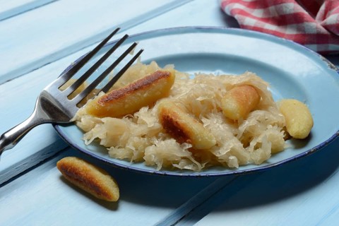 Fried puff noodles with sauerkraut on plate