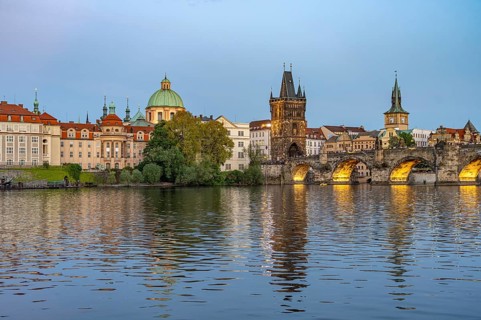 Old Town of Prague with Vltava River, Charles Bridge and Old Town Bridge Tower at dusk, Prague,