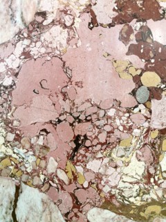 Pink and brown marble surface with natural patterns