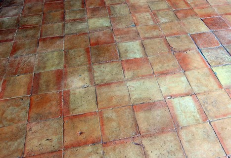 Rustic terracotta tiles with vivid earthy tones and square pattern