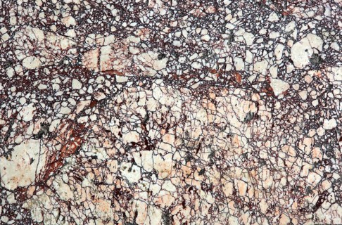 Beige marble with red contrasts, dramatic and complex texture