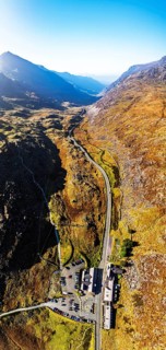 Autumn colours of Pen-y-Pass over Miner's Track, Start Point and road A4086 from a drone,