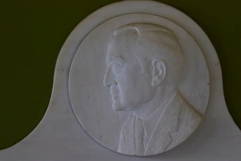Marble relief depicts Rudolph A. Peterson, a sponsor of the Archaeological Museum in Nemea, marble