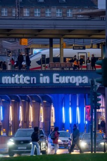 The main train station in Essen, blue illuminated underpass, bus station, am Europaplatz, ICE train