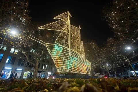 The KurfÃ¼rstendamm in western Berlin with Christmas lights and several light installations, such