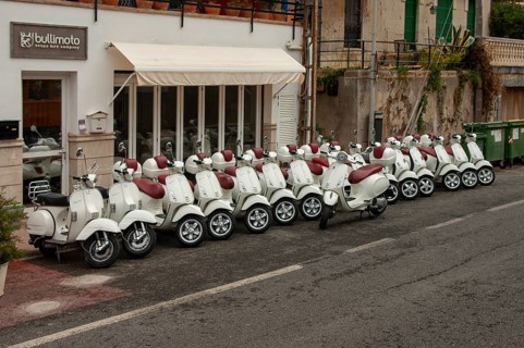 Many scooters for rent are in front of a shop, Port de Soller, Majorca, Spain