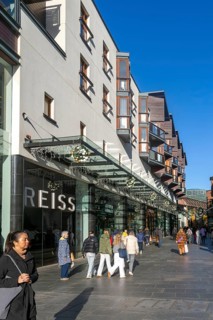 Shoppers walking past Reiss shop store in city centre, Princesshay, Exeter, Devon, England, UK