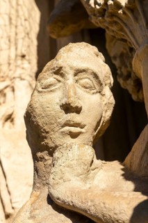 Deati lof face of carved stone figure on West Front of Exeter cathedral church, Exeter, Devon,