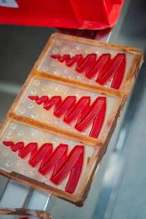Red tree molds in a plastic chocolate mold, ready for casting, Christmas baking, Haselstaller Hof,